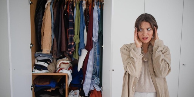 a messy closet and a lady looking shocked at the mess